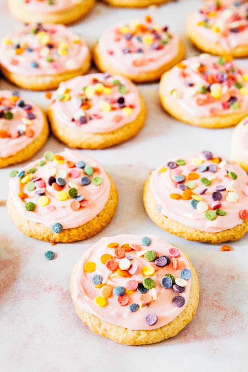 Raspberry Lemon Lofthouse Cookies with pink frosting and colorful confetti sprinkles
