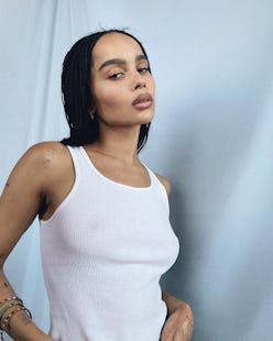 Zoë Kravitz poses in a white tank top.