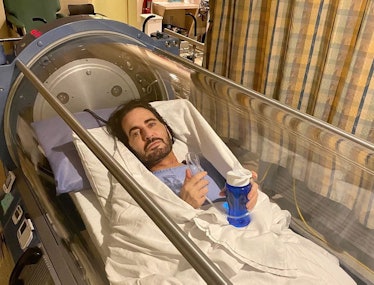 Marc Jacobs lying in a hyperbaric oxygen chamber after his facelift.