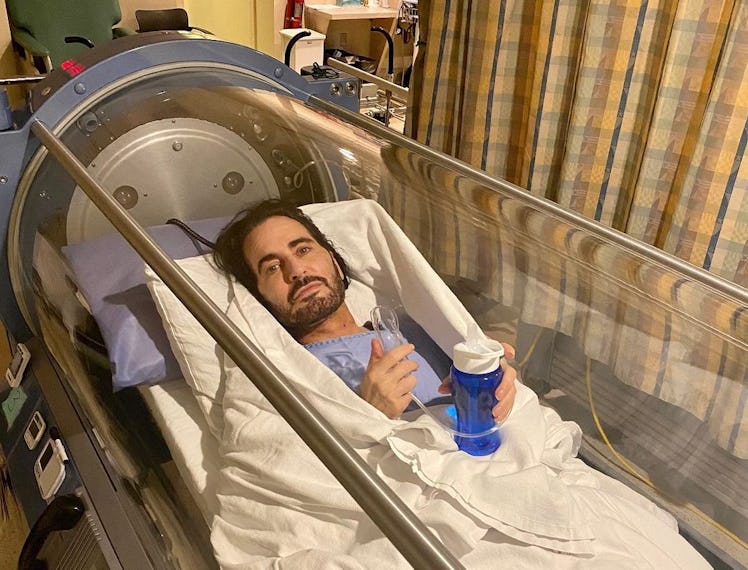 Marc Jacobs lying in a hyperbaric oxygen chamber after his facelift.