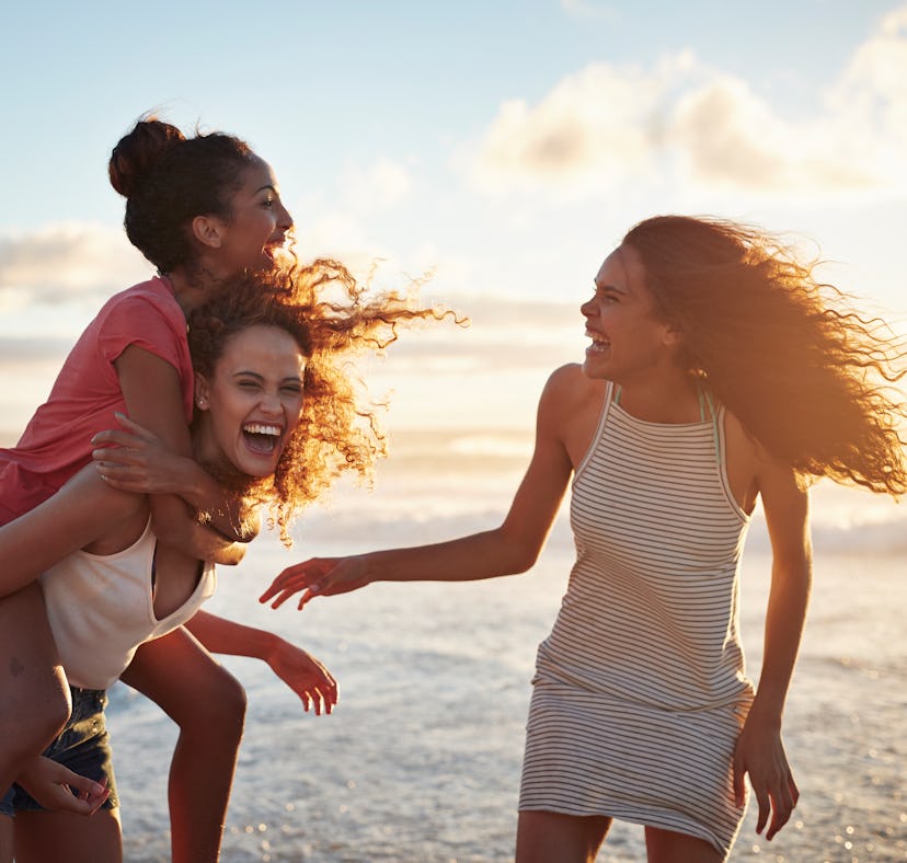 3 young women laughing at the beach, in need of caption for trip with friends, travel with friends c...