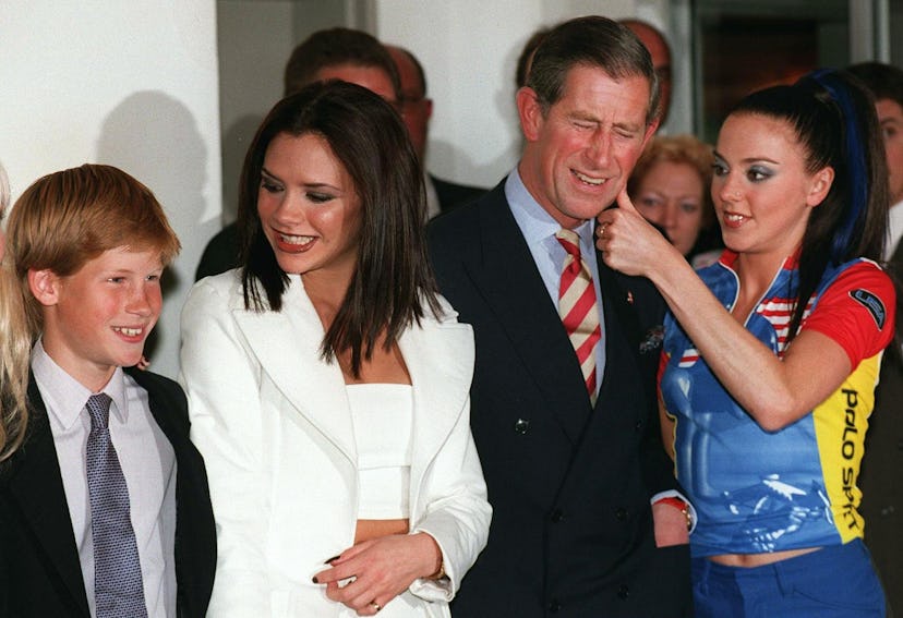 Prince Harry (L) poses with Spice Girls Victoria (2D L) as his father, HRH Prince Charles (2D R), ge...