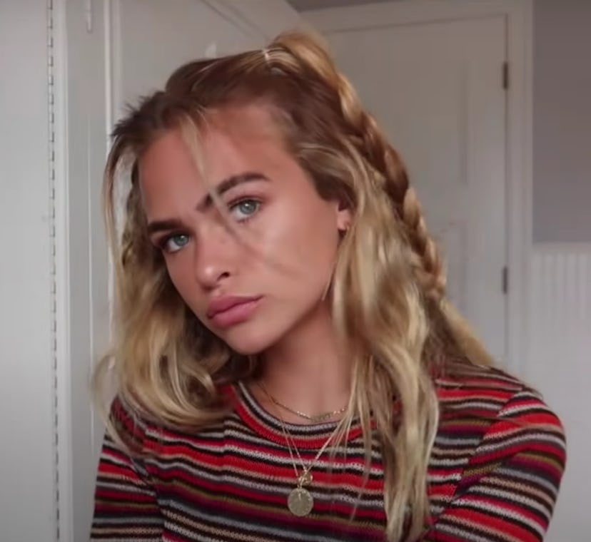 Teen posing with hair in half-pigtails braided
