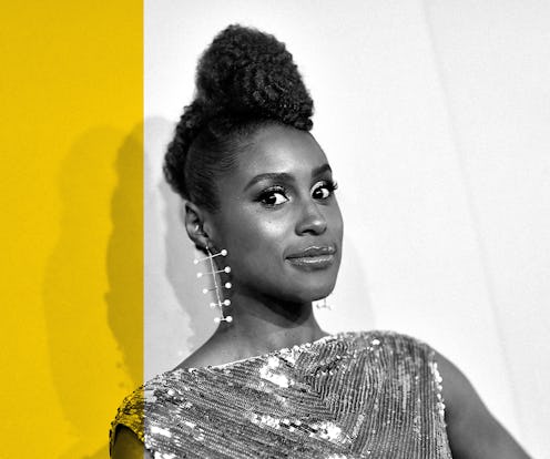 Issa Rae wearing a sequin party dress, with her soft curls in a high bun