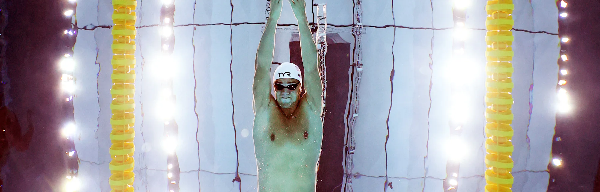 Michael Andrew of Team United States competes in heat five of the Men's 100m Breaststroke on day one...