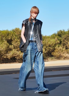 A model wearing baggy Celine Homme pants designed by Hedi Slimane