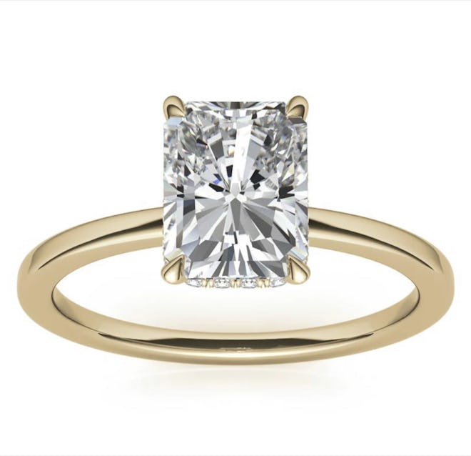 AWU Jewelry's emerald engagement ring with a hidden halo. 
