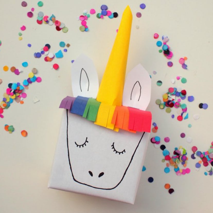 Unicorn gift wrap is a fun construction paper craft to make with kids. 