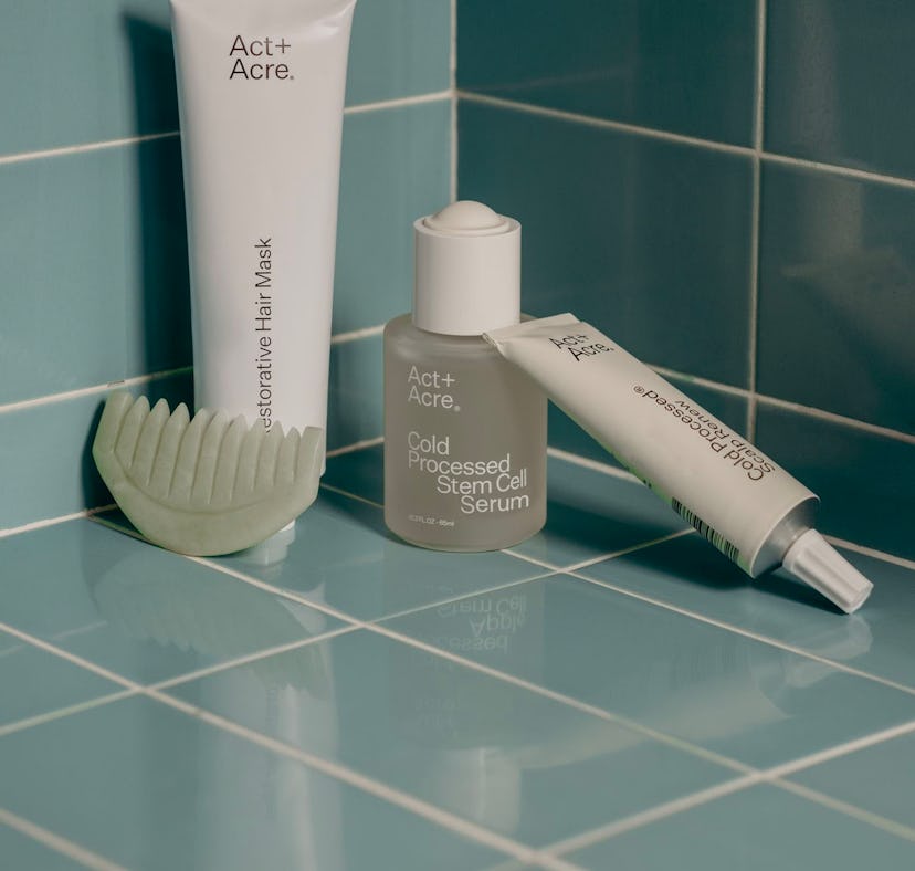 A still life product photo of Acte+Acre's Cold Processed Stem Stell Serum for hair and scalp alongsi...