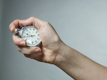 hand holding stopwatch