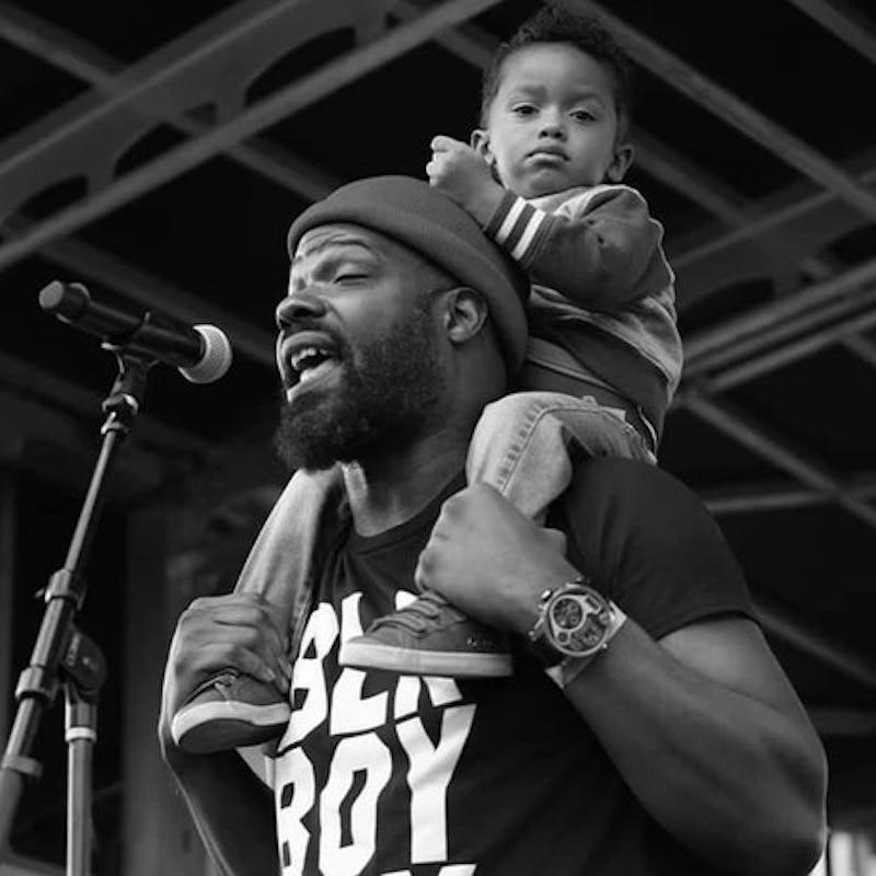 Shawn William performs with his son.