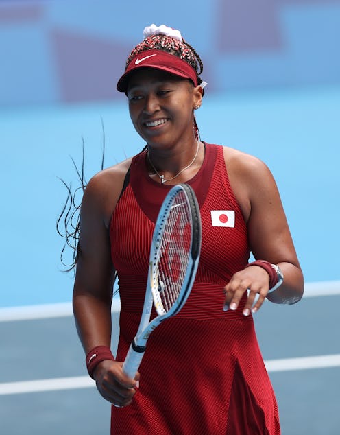 Naomi Osaka of Team Japan prepares to receive serve during her Women's Singles Second Round match ag...