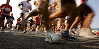 : Runners make their way through a Brooklyn neighborhood during the New York City Marathon November ...