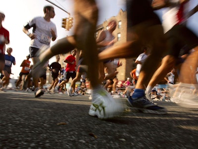 : Runners make their way through a Brooklyn neighborhood during the New York City Marathon November ...