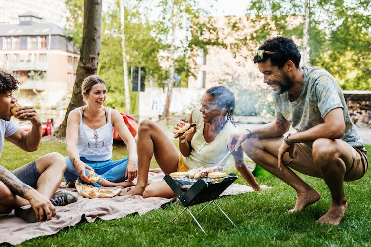 Young friends having a backyard barbecue, in need of bbq captions for Instagram.