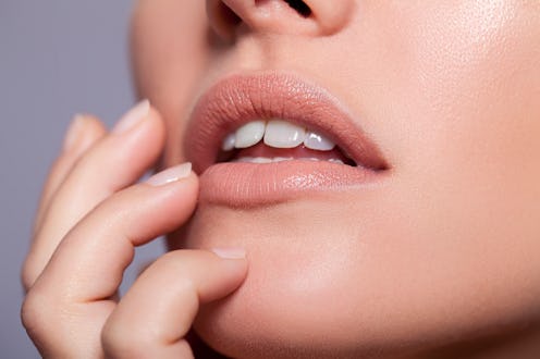 Woman touching chin