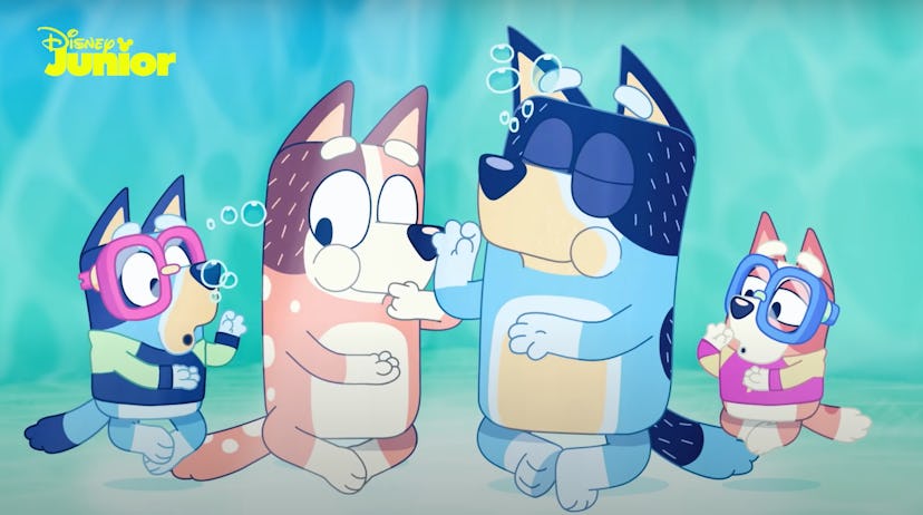 scene from the show 'Bluey', family swimming underwater 