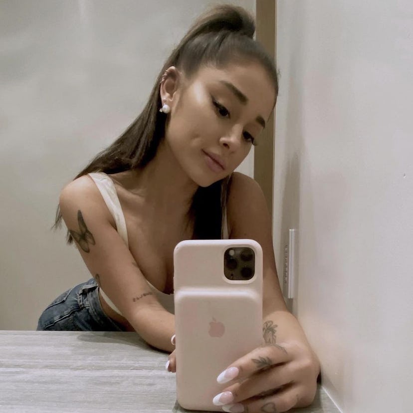 Ariana Grande has spaced-out patchwork tattoos on her arm.