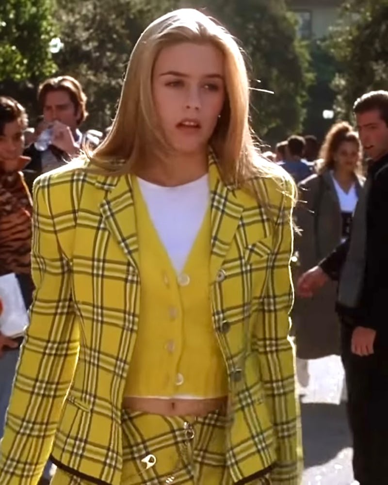 Alicia Silverstone as Cher Horowitz in her iconic yellow plaid outfit in Clueless. 
