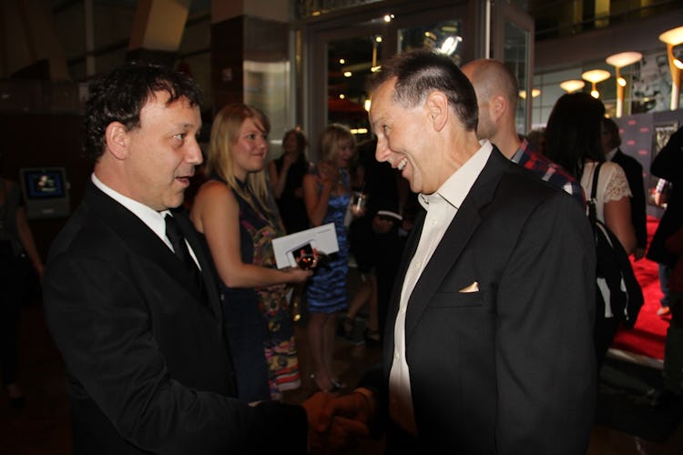 The Possession producer Sam Raimi greets Haxton at the film’s Hollywood premiere, Aug. 30, 2012.