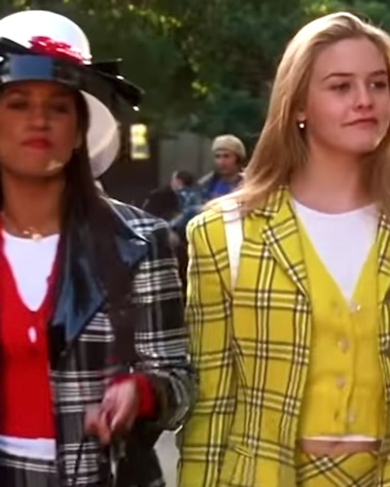 Alicia Silverstone as Cher Horowitz in her iconic yellow plaid outfit in Clueless. 