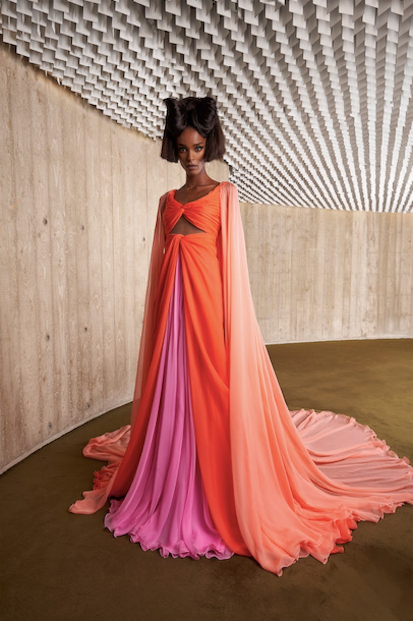 A model wearing a Giambattista Valli's orange and pink tulle at the Fall 2021 Couture Fashion Week