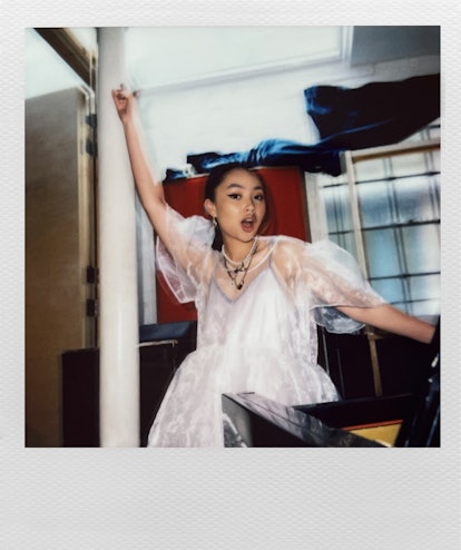 Sarah Griffiths, 20-year-old singer, known as Griff, in a polaroid dancing in a white sheer dress