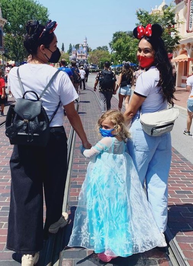 Brie and Nikki Bella, with Brie's daughter, Birdie, at Disneyland on May 13. 