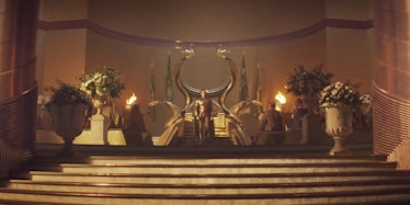 Loki sits on a gold throne in Loki.