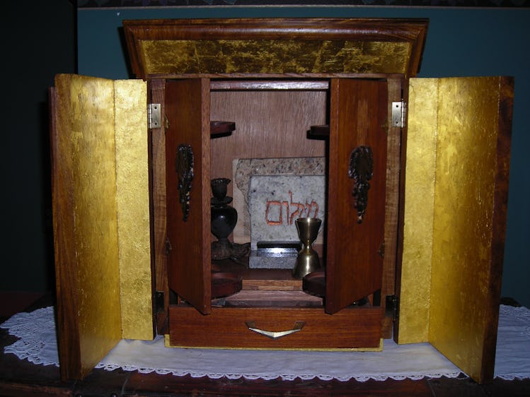 The opened Dybbuk Box is housed in an acacia-wood ark lined with gold leaf, which Jason Haxton built...
