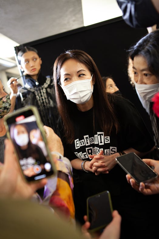 Chitose Abe backstage at Jean Paul Gaultier, wearing an ‘Enfant Terrible' t-shirt.