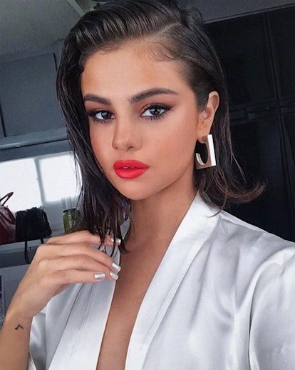 Selena Gomez made a case for wet hair back in 2017, where she shared a selfie sporting a slick bob, silver nails, and super bright red lipstick.