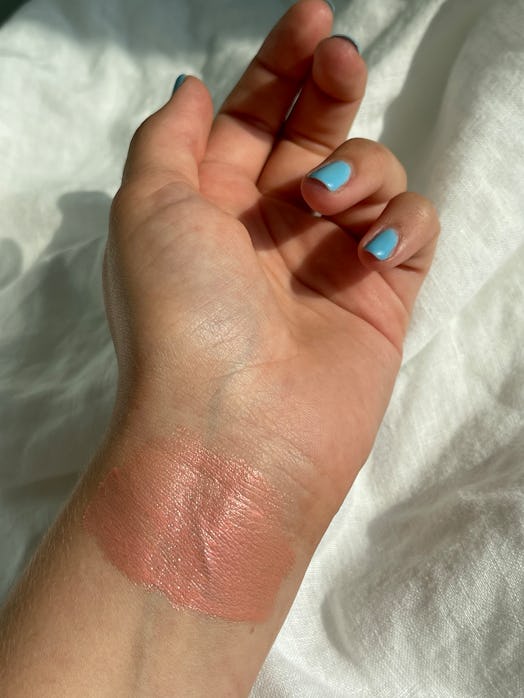 a swatch of the product on Isabella's wrist