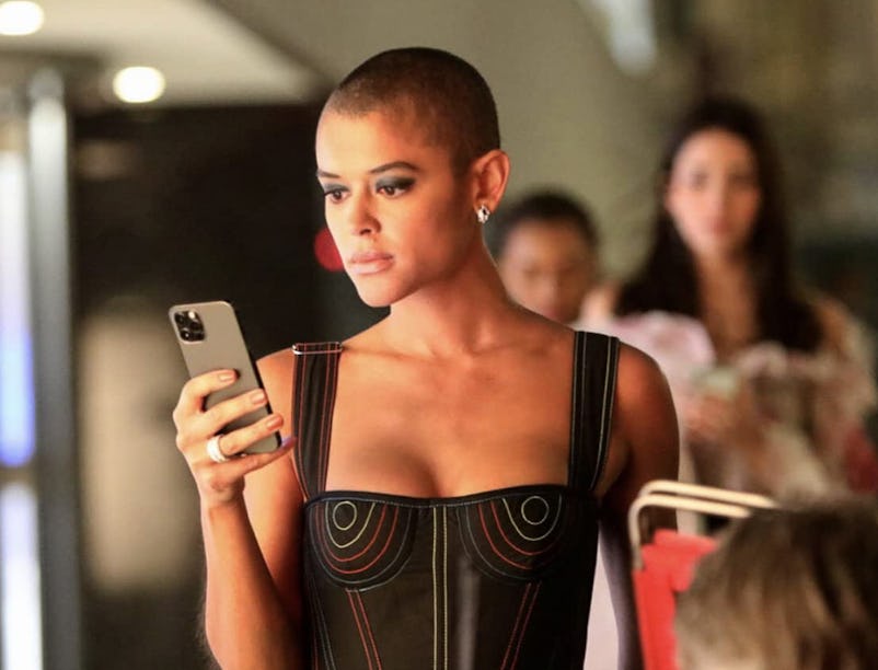 Jordan Alexander looks at a phone during a scene of HBO Max's 'Gossip Girl' reboot, which sparked th...