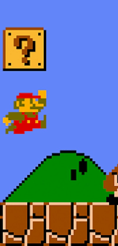 Mario jumping over goomba in Super Mario Bros.