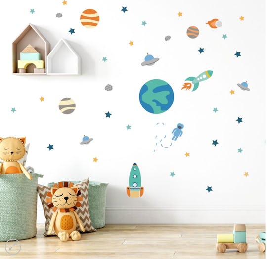 space-themed wall decals on nursery walls