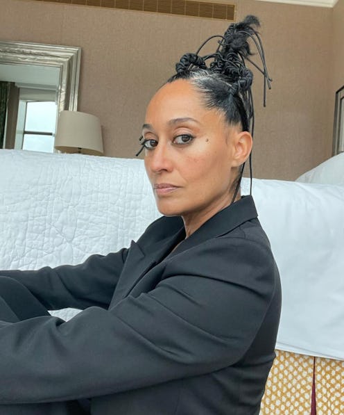 Tracee Ellis Ross in a black shirt and a sculptural updo for Pyer Ross