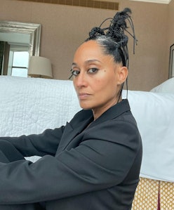 Tracee Ellis Ross in a black shirt and a sculptural updo for Pyer Ross