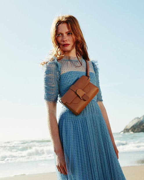 Model wearing Senreve belt bag.
