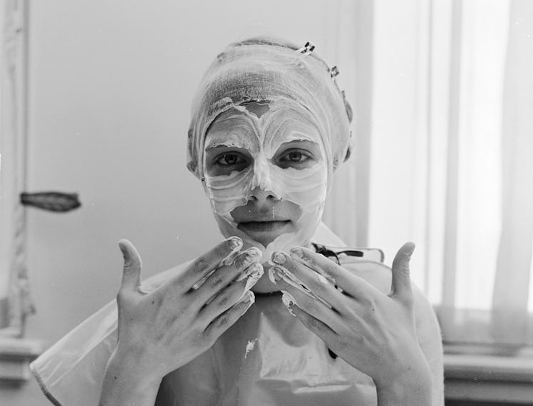 woman applying face cream