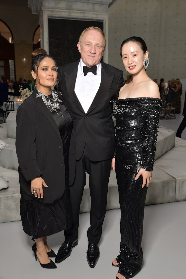 Salma Hayek Pinault, François-Henri Pinault, and Meng Li at the Balenciaga 50th Couture Collection D...