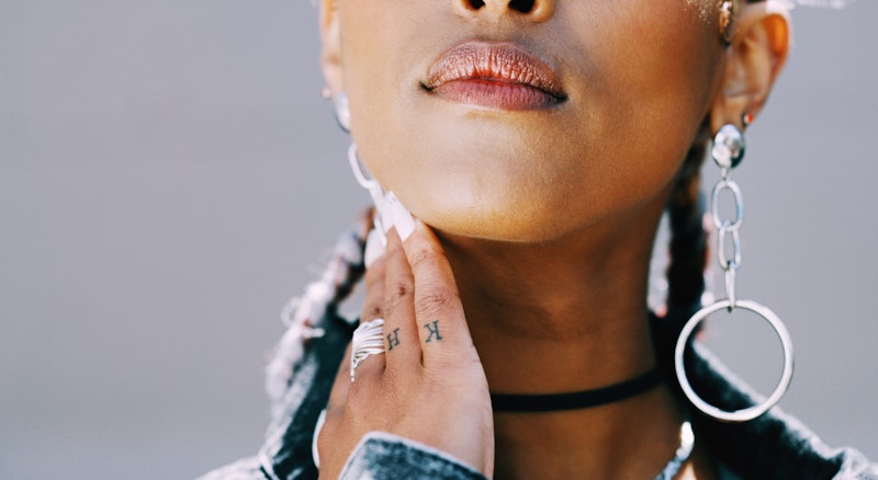 Experts break down everything you need to know before getting an inner lip tattoo.