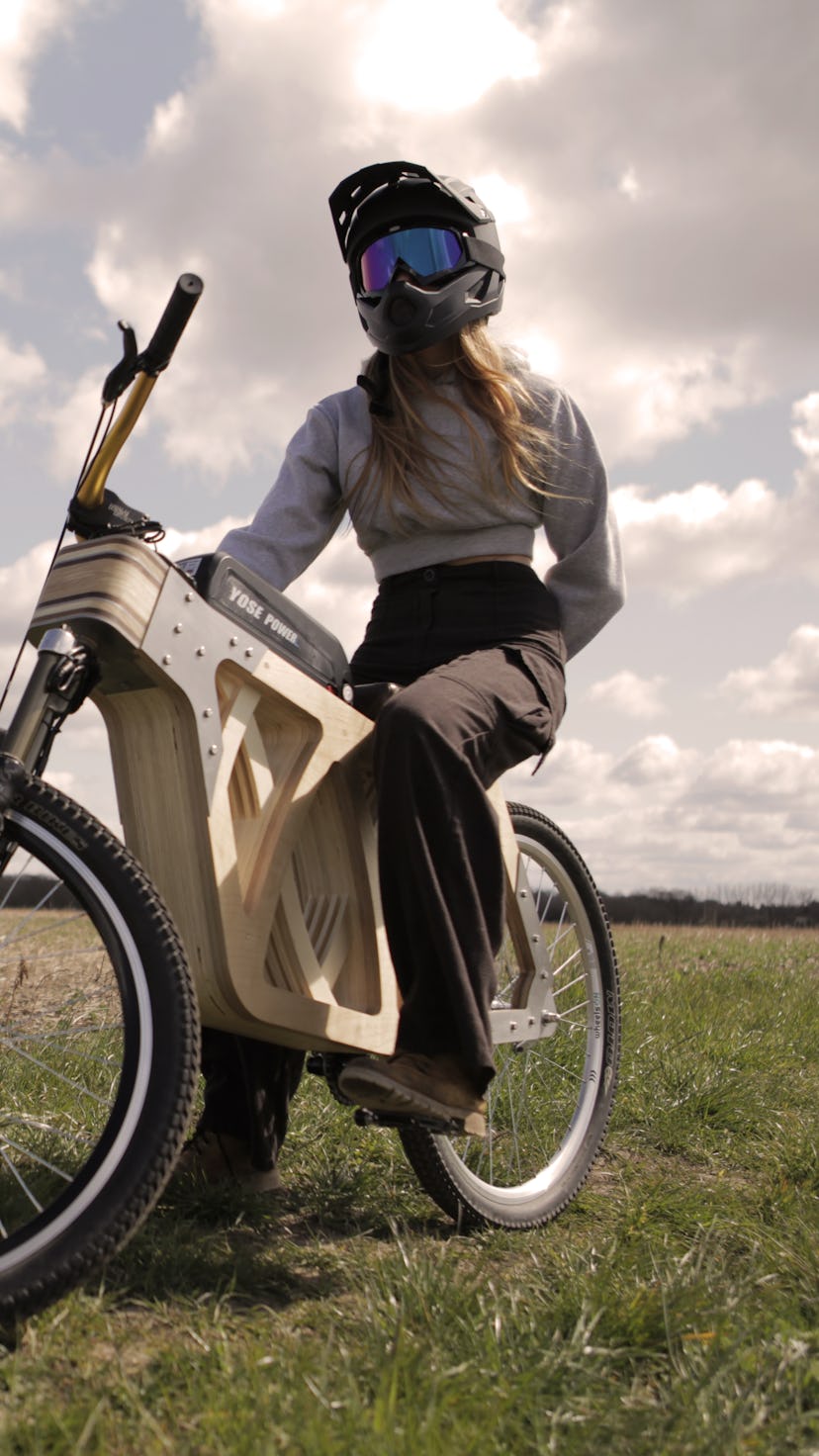A high-res image of Electraply, a wooden electric bike made by mode maker, Evie Bee. Electric vehicl...