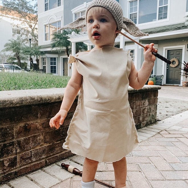 Toddler in crochet hat and costume shirt/dress to look like Dobby from "Harry Potter"