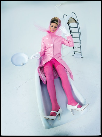 Margot Robbie in a pink coat.