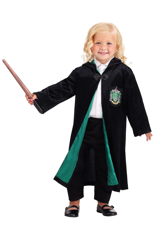 Toddler girl dressed up in Harry Potter Slytherin robe costume