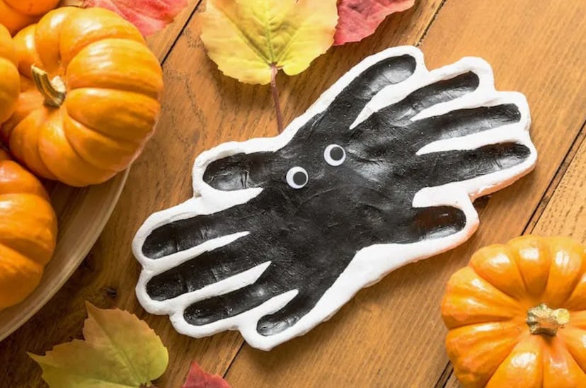 Clay handprint spiders is a fun Halloween handprint art idea.