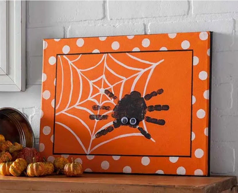 A spider canvas is one Halloween handprint art idea to try.