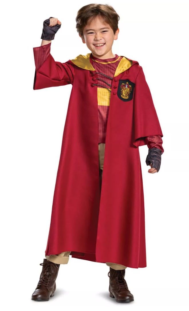 Boy wearing a red Harry Potter Quidditch costume 