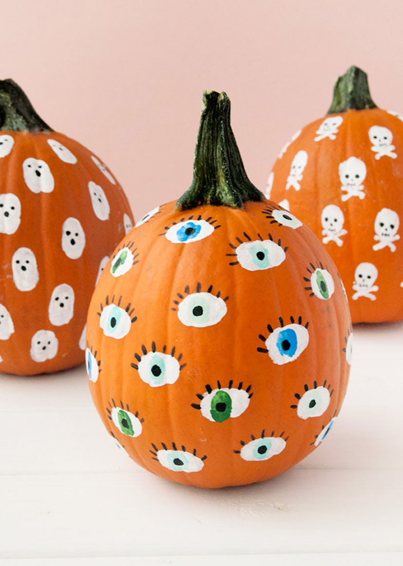 Fingerprint pumpkins make cute Halloween handprint art.